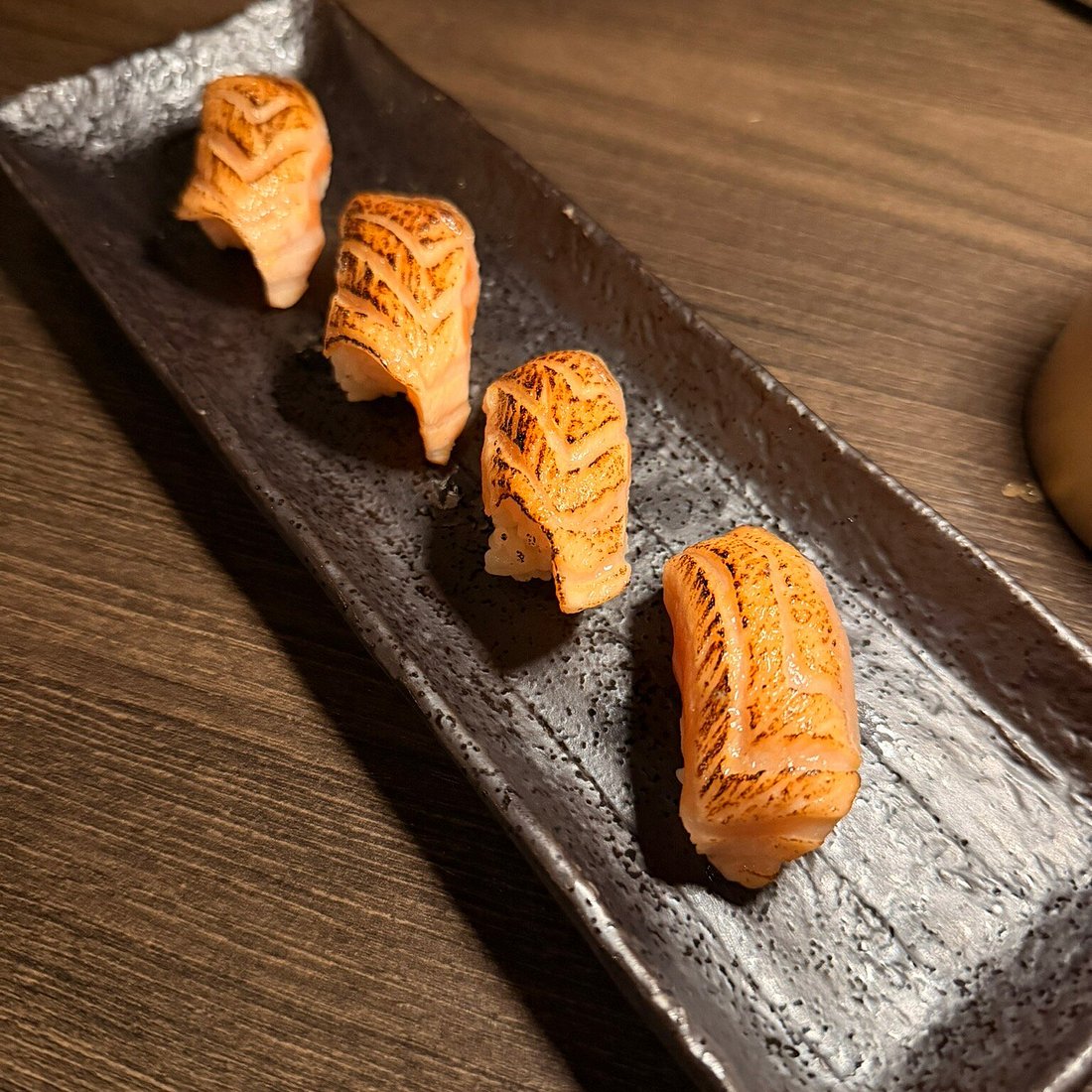 Sado signature dishes Nigiri SamplerHamachi CrudoBinchotan Charcoal Grill Dishes